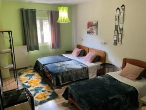 A bed or beds in a room at Queen of Orliaka