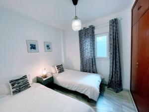 Posteľ alebo postele v izbe v ubytovaní Central Apartment in Sanlucar