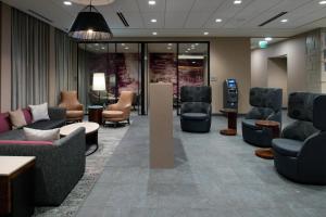 a waiting room with couches and chairs in a hospital at Courtyard Charlotte Steele Creek in Charlotte