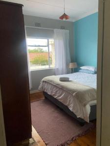 a bedroom with a bed and a window at 60 ON Kennington in East London
