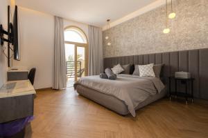 a bedroom with a large bed and a large window at Luxurious Villa 5BHK with Pool BBQ and Full Time Housemaid Assistance - live in in Dubai