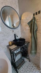 a bathroom with a sink and a mirror on a wall at Wohlfühl Landhaus in Habkirchen
