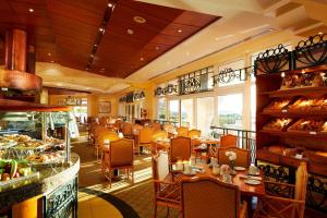 a dining room with tables and chairs in a restaurant at Hurghada Marriott Beach Resort in Hurghada