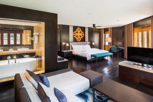 a hotel room with a bed and a bath tub at Le Meridien Paro Riverfront in Paro +44 photos