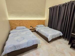 Postel nebo postele na pokoji v ubytování Bee Homestay