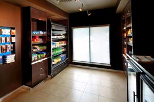a kitchen with a large window and a walk in refrigerator at Courtyard Newark Granville in Newark