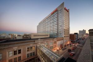 a tall building on a city street with cars at Louisville Marriott Downtown in Louisville