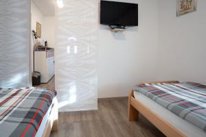 Postel nebo postele na pokoji v ubytování Apartma Maka