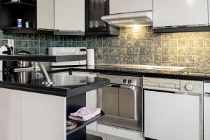 Kuchyň nebo kuchyňský kout v ubytování Apartma Maka
