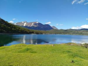 a view of a lake with mountains in the background at Departamento Centro Ushuaia in Ushuaia