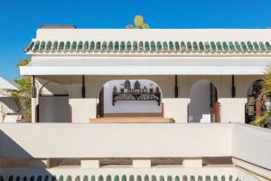 a view of the back of a white house at Dar Mo'Da in Marrakech +56 photos