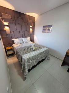 Una cama o camas en una habitación de Brisa do Mar