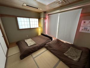 Letto o letti in una camera di Hotel EL 8（宇都宮駅東口）