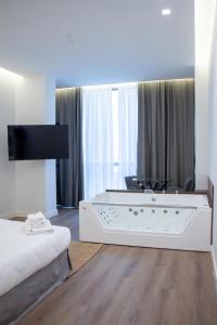 Ένα ή περισσότερα κρεβάτια σε δωμάτιο στο Central Promenade