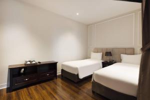 Postel nebo postele na pokoji v ubytování Maro Hotel & Apartment