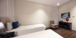 Postel nebo postele na pokoji v ubytování Maro Hotel & Apartment