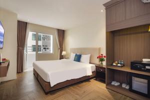 Postel nebo postele na pokoji v ubytování Maro Hotel & Apartment