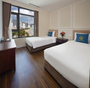 Postel nebo postele na pokoji v ubytování Maro Hotel & Apartment