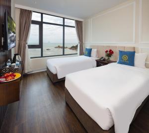 Postel nebo postele na pokoji v ubytování Maro Hotel & Apartment