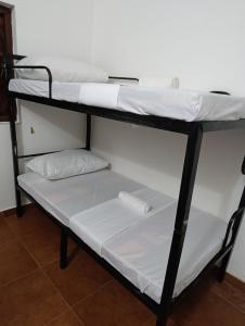 Postel nebo postele na pokoji v ubytování S and P Airport transit hostel and villa 01