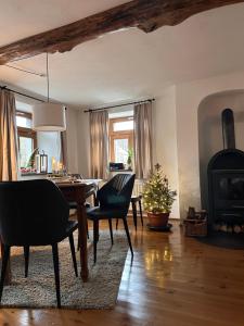 a living room with a table and chairs and a fireplace at Gut Kalkhäuschen, ein Ort mit Geschichte in Aachen +47 photos