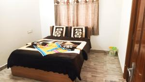 a bedroom with two beds with stuffed animals on them at Cloud9Villa Resorts in Yelagiri +21 photos