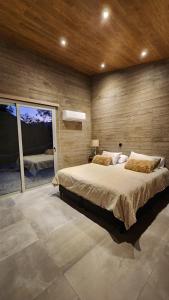 Ένα ή περισσότερα κρεβάτια σε δωμάτιο στο La Quebrada Potrerillos - Lodges de Montaña