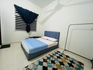 Postel nebo postele na pokoji v ubytování Relax Homestay Kuantan