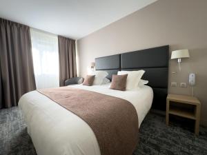 Postel nebo postele na pokoji v ubytování Hôtel Vauban Briançon Serre Chevalier