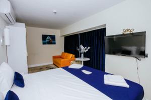 TV o dispositivi per l'intrattenimento presso Elite Class Sea View Aparthotel In Orbi City Batumi
