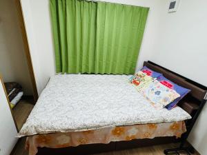 Postel nebo postele na pokoji v ubytování Vivere南5条