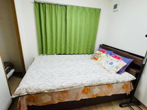 Postel nebo postele na pokoji v ubytování Vivere南5条