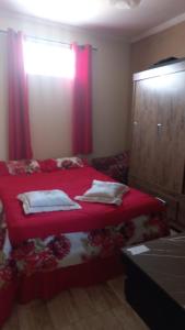 Giường trong phòng chung tại Casa charmosa Águas de Lindóia 2 km do centro