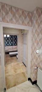a room with a room with a bed and a door at S-e-r-a-l-y 1 in Égliseneuve-dʼEntraigues