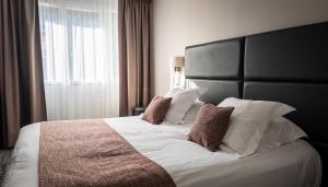 Postel nebo postele na pokoji v ubytování Hôtel Vauban Briançon Serre Chevalier