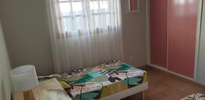 Letto o letti in una camera di Villa Terracotta, vue mer imprenable