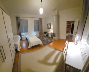 a large living room with a bed and a couch at Ilona 3 Vanha Rauma in Rauma