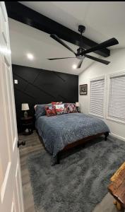 a bedroom with a bed and a ceiling fan at Downtown Bourbon House in Somerset +9 photos