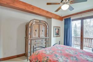 a bedroom with a large wooden dresser and a bed at Cozy Avon Retreat w/ Private Deck & Pool Access! in Avon