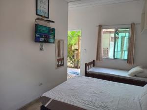 Ένα ή περισσότερα κρεβάτια σε δωμάτιο στο Pousada Nova Primavera +88 φωτογραφίες