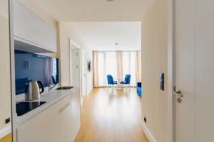 TV o dispositivi per l'intrattenimento presso Relax and Unwind Premier Sea View Aparthotel in Batumi