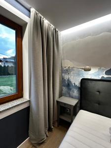 Posteľ alebo postele v izbe v ubytovaní Villa Monica Apartamenty