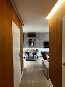 Televízia a/alebo spoločenská miestnosť v ubytovaní Villa Monica Apartamenty