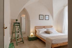 Postel nebo postele na pokoji v ubytování Masseria Pugliese Farm + 37 fotografií