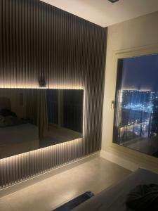 a bedroom with a window with a view of a city at إشراقة النيل in Cairo