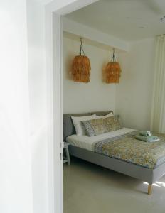Postel nebo postele na pokoji v ubytování Utopia Varkala - Boutique stay in Odayam rice fields