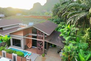 an aerial view of a house with a pool at Ploy Mountain View Pool Villa in Ban Thai Thai
