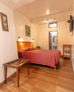 Rúm í herbergi á Saphi Inn Cusco - Excelente ubicación