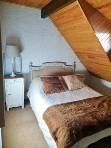 Postel nebo postele na pokoji v ubytování Hameau des Granges
