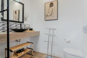 a bathroom with a sink and a mirror at Casa Mario Suites in Santa Cruz de Tenerife